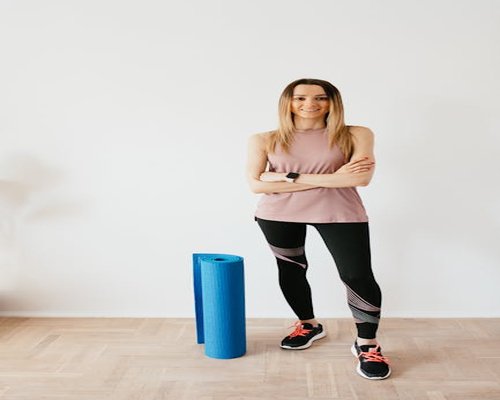 Portrait of yoga instructor standing in studio