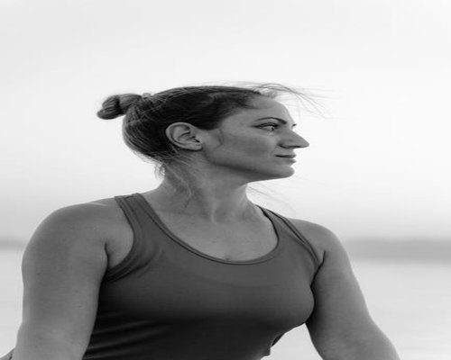 Portrait of female yoga teacher smiling softly